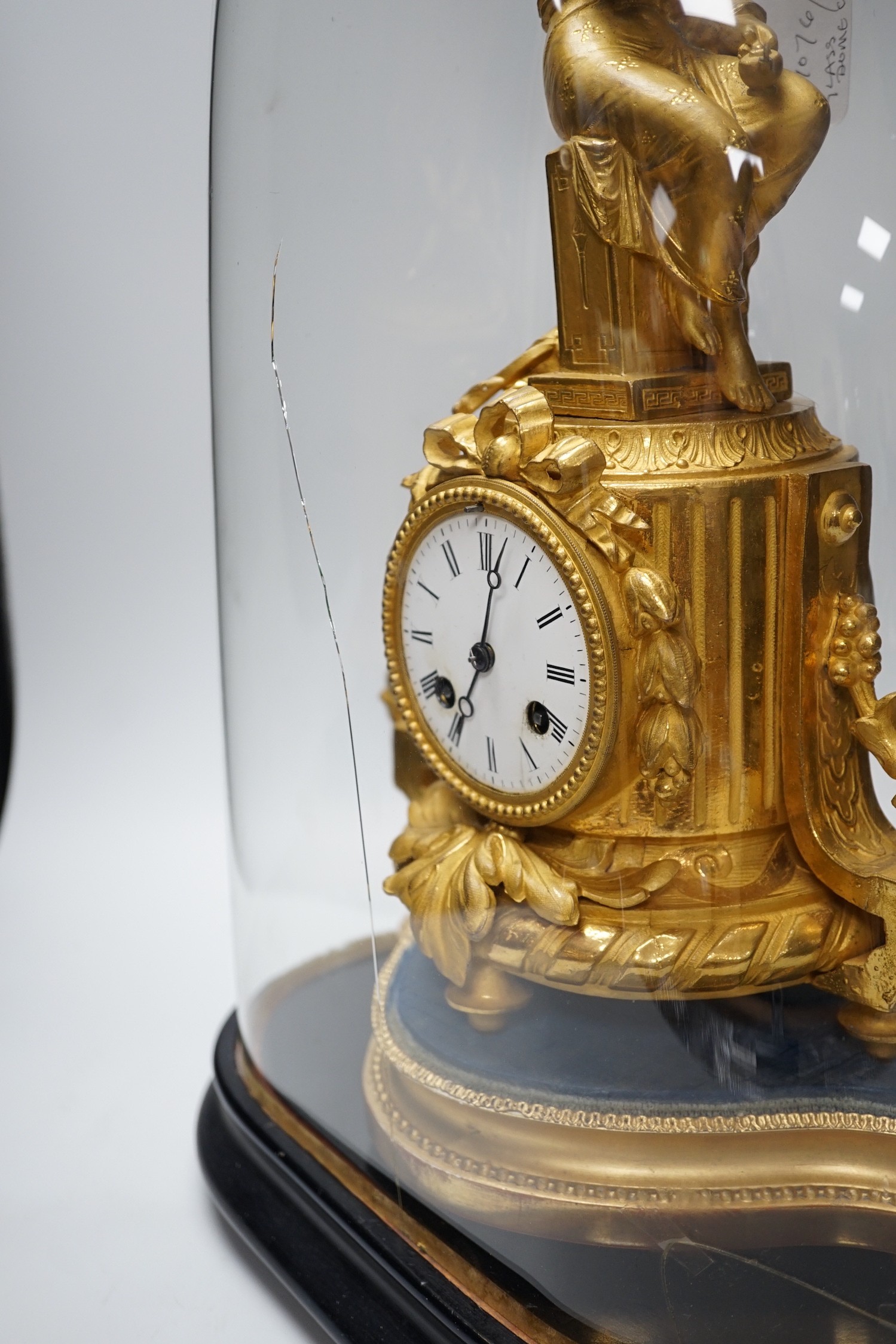 A French 19th century gilt metal clock by Phillipe H. Mourey on stand with glass dome, total height 49cm (dome a.f.)